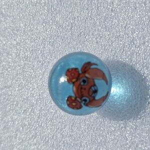 Paras #48 Pokemon vintage 1990's light blue glass marble